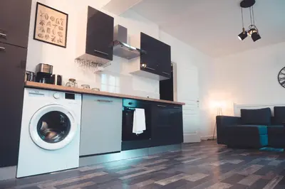 Cuisine ou kitchenette dans l'établissement Le Cube Soma - Confortable T3