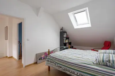 Un ou plusieurs lits dans un hébergement de l'établissement La Guinebaudière - Maison avec terrasse