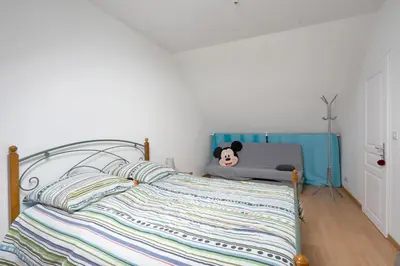 Un ou plusieurs lits dans un hébergement de l'établissement La Guinebaudière - Maison avec terrasse