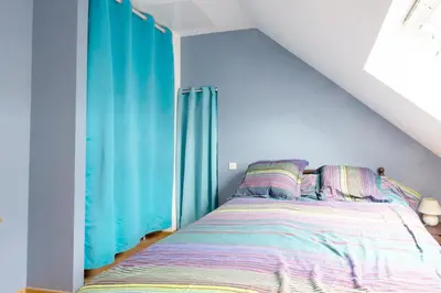 Un ou plusieurs lits dans un hébergement de l'établissement La Guinebaudière - Maison avec terrasse