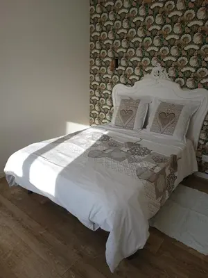 Un ou plusieurs lits dans un hébergement de l'établissement La Petite Maison Dans La Prairie
