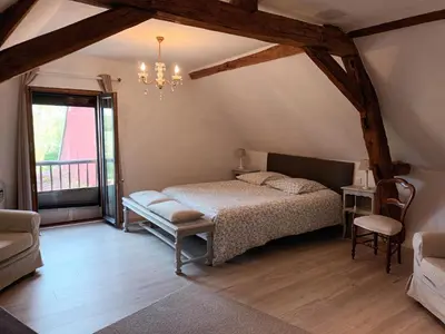 Un ou plusieurs lits dans un hébergement de l'établissement La chouett'chambre