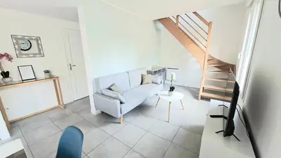 Coin salon dans l'établissement Appartement Duplex Cosy avec place de parking privée