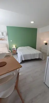 Un ou plusieurs lits dans un hébergement de l'établissement Charmant studio centre de Bourgueil
