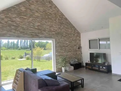 Coin salon dans l'établissement Maison au calme