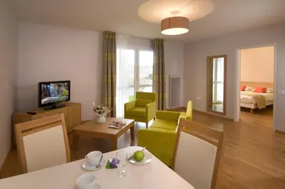 Télévision ou salle de divertissement dans l'établissement DOMITYS Le Vallon des Bois