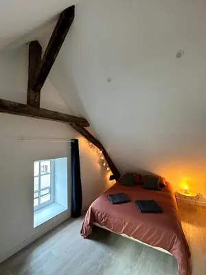 Un ou plusieurs lits dans un hébergement de l'établissement Appartement atypique et chaleureux - 1 chambre