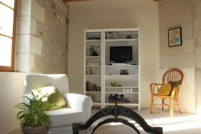 Télévision ou salle de divertissement dans l'établissement Gîte Moulin d'Olivet