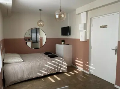 Un ou plusieurs lits dans un hébergement de l'établissement Duplex et Studio Saint Martin Le Beau