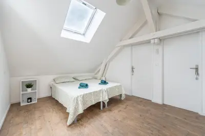 Un ou plusieurs lits dans un hébergement de l'établissement Duplex et Studio Saint Martin Le Beau