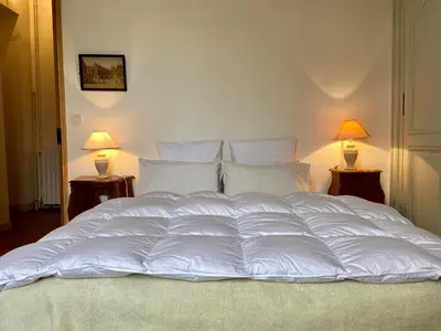 Un ou plusieurs lits dans un hébergement de l'établissement Chateau la Bainerie