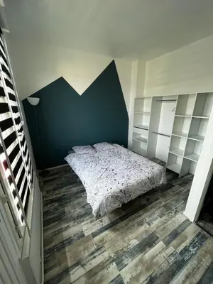 Un ou plusieurs lits dans un hébergement de l'établissement Appartement 4 personnes proche d’un Circuit 24h du Mans