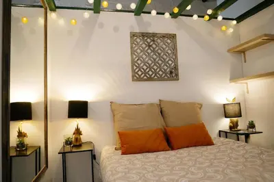 Un ou plusieurs lits dans un hébergement de l'établissement Studio cosy hypercentre Terrasse