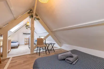 Un ou plusieurs lits dans un hébergement de l'établissement Appartement duplex rénové vue sur la Loire