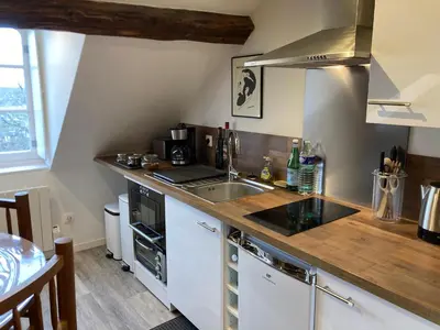 Cuisine ou kitchenette dans l'établissement Un séjour royal au calme