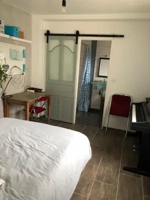 Un ou plusieurs lits dans un hébergement de l'établissement Maison La Suze