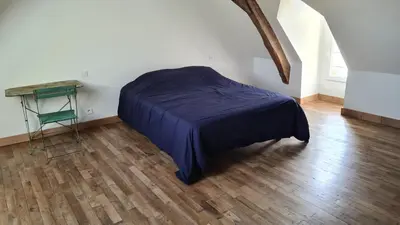 Un ou plusieurs lits dans un hébergement de l'établissement Maison Bourgueil 3 chambres