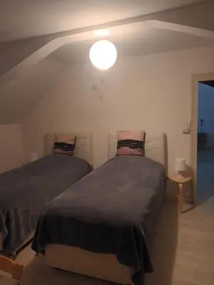 Un ou plusieurs lits dans un hébergement de l'établissement Le Gîte au Pied du Château de Chaumont