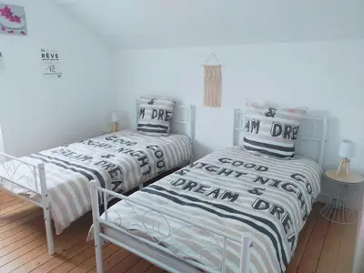 Un ou plusieurs lits dans un hébergement de l'établissement Charmante maison entièrement rénovée cœur de ville