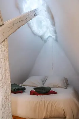 Un ou plusieurs lits dans un hébergement de l'établissement La tanière du sorcier