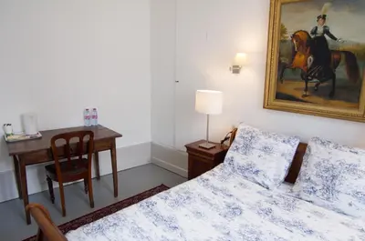 Un ou plusieurs lits dans un hébergement de l'établissement Les Chambres Panda