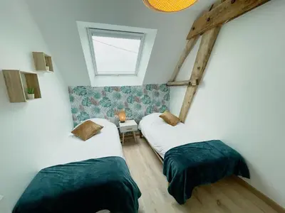 Un ou plusieurs lits dans un hébergement de l'établissement Gîte à Luzillé avec jardin privé et climatisation - FR-1-381-532