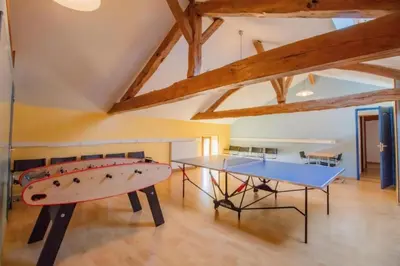 Salle de jeux dans l'établissement Manoir Les Touches - Gîtes