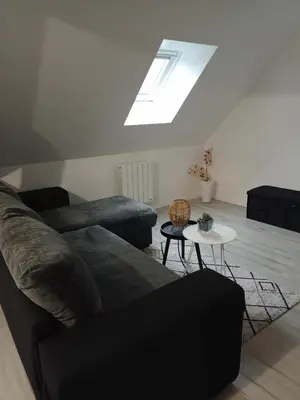 Coin salon dans l'établissement appart 2 chambres