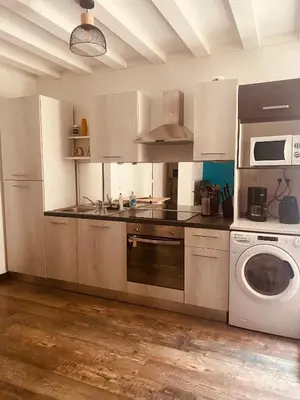 Cuisine ou kitchenette dans l'établissement Au porte du château