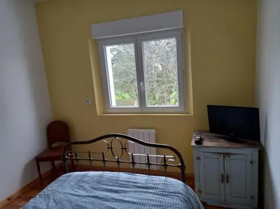 Un ou plusieurs lits dans un hébergement de l'établissement Maison 3 chambres circuit des 24h Le Mans