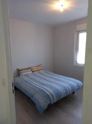 Un ou plusieurs lits dans un hébergement de l'établissement Maison 3 chambres circuit des 24h Le Mans