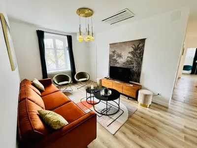 Coin salon dans l'établissement Inédit : appartements grandes capacités sur les quais de Blois - 23 pers