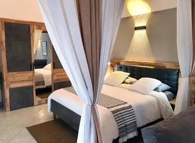 Un ou plusieurs lits dans un hébergement de l'établissement La Chambre des Châteaux