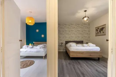 Un ou plusieurs lits dans un hébergement de l'établissement La Bulle Détente : Maison avec Jacuzzi et Sauna
