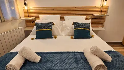Un ou plusieurs lits dans un hébergement de l'établissement Duplex élégant Tours quais de Loire