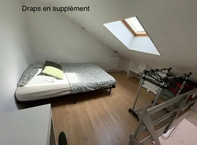 Un ou plusieurs lits dans un hébergement de l'établissement Appartement T1B place saint Anne