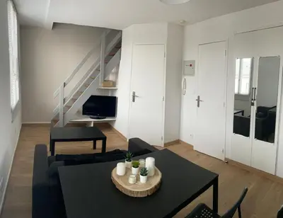 Coin salon dans l'établissement Appartement T1B place saint Anne