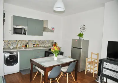 Cuisine ou kitchenette dans l'établissement *Cocooning Family*