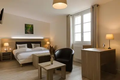 Un ou plusieurs lits dans un hébergement de l'établissement Hôtel Le Haut des Lys