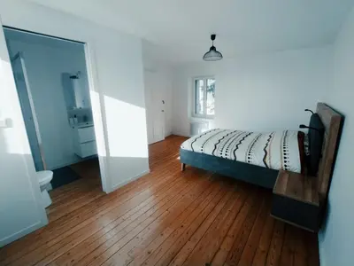 Un ou plusieurs lits dans un hébergement de l'établissement C'COZY - grande maison calme et lumineuse