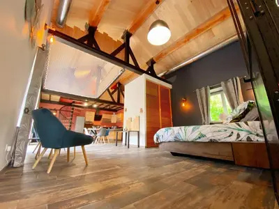 Un ou plusieurs lits dans un hébergement de l'établissement Loft industriel avec Spa, Sauna et Hammam en Touraine – Jardin clos et équipements haut de gamme - FR-1-381-559