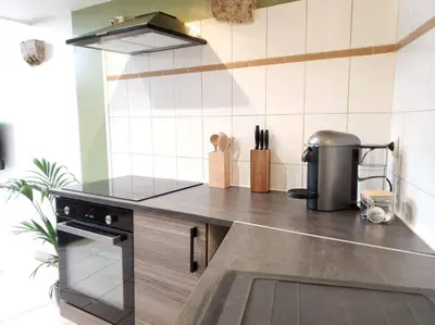 Cuisine ou kitchenette dans l'établissement Dupplex, centre ville