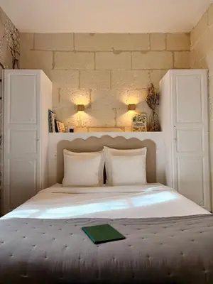 Un ou plusieurs lits dans un hébergement de l'établissement Le Presbytère • Maison Flore