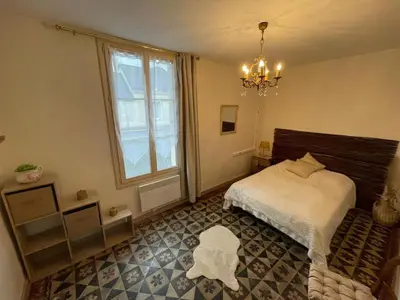 Un ou plusieurs lits dans un hébergement de l'établissement Appartement rez de jardin