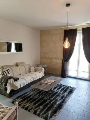 Coin salon dans l'établissement Appartement rez de jardin