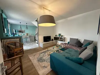 Coin salon dans l'établissement Maison de ville idéalement placée