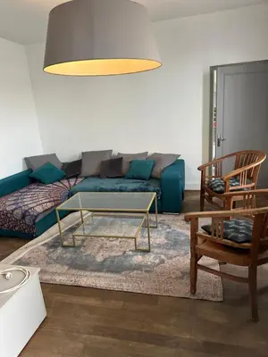 Coin salon dans l'établissement Maison de ville idéalement placée