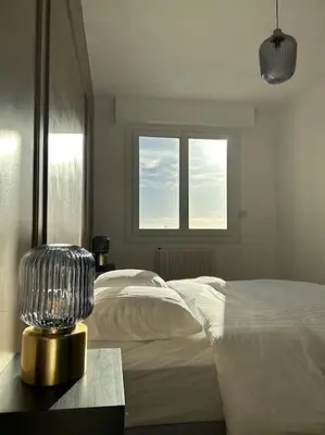 Un ou plusieurs lits dans un hébergement de l'établissement Appartement de charme hyper centre Le Mans