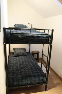 Un ou plusieurs lits dans un hébergement de l'établissement Charmante maison à la campagne