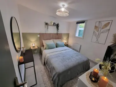 Un ou plusieurs lits dans un hébergement de l'établissement Agréable Logement / Netflix